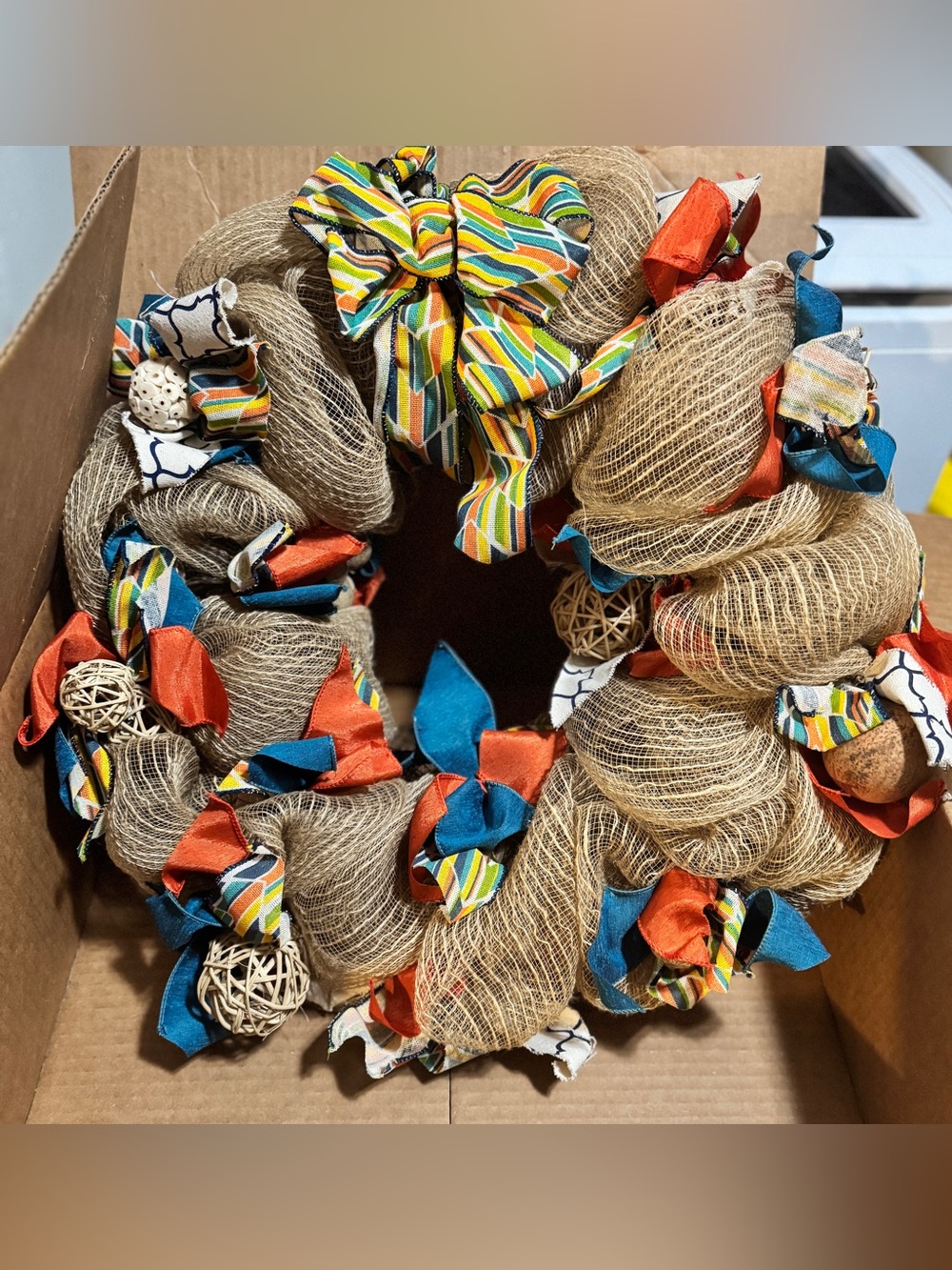 Decorative Natural Burlap Wreath with Blue, Orange & Multicolor Accents